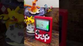 A bootleg Supreme Gameboy. This is really a famiclone handheld that plays nes fakes.